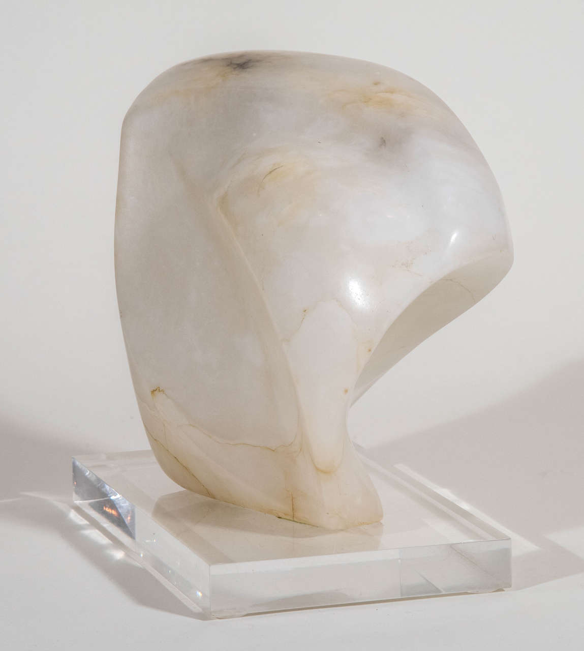 A sensuous and lustrous alabaster sculpture on original lucite base.
The piece is very decorative and signed on the bottom Blo 99.